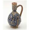 Image 1 : A Victorian Doulton stoneware jug by Frank Butler, with incised detail and glazed in blue and gre...