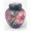 Image 1 : A Moorcroft Anemone vase and cover, ovoid with pink flowers and green leaves against a deep blue...