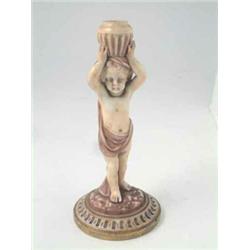 A Victorian Royal Worcester water carrier, semi-nude boy holding vase aloft, on circular base, da...