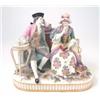 Image 1 : A 19th century Meissen figure group, gentleman and female companion seated on settee, she reading...