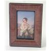 Image 1 : A small 19th century German porcelain plaque, painted with a semi-nude lady playing with a butter...
