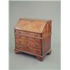 Image 1 : A George I burr walnut bureau, with feather and crossbanding, slant enclosing stepped interior an...