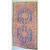 Image 1 : A Turkish village rug, early 20th century, the pink field with two large blue medallions, 6ft 7in...