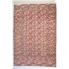 Image 1 : A Tekke Turkoman rug, early 20th century, the brown-red field with three columns of nine octagona...