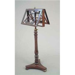 An early Victorian rosewood duet stand with lyre decorated ratcheted stands on turned baluster st...