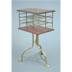 An Edwardian mahogany and brass revolving canterbury on brass tripod, stamped S.H. & S., 1ft. 5in...