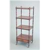 Image 1 : An early Victorian mahogany four tier whatnot, with turned uprights and base drawer on toupie leg...