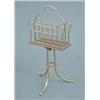 Image 1 : An Edwardian brass and oak revolving canterbury on tripod base with claw feet, height 2ft.4ins....
