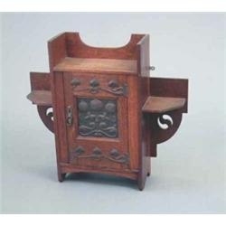 An oak Art Nouveau hanging cabinet, with floral copper panel and heart appliqués to the hinges, 2...