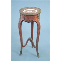 A late 19th century French kingwood and floral marquetry circular occasional table, with gilt met...