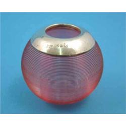A late Victorian cranberry glass match tidy of ribbed globular form with silver mounted rim, 2.25...