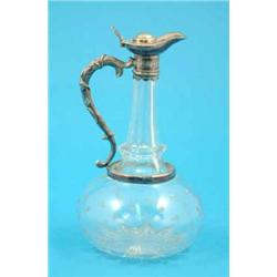 A Victorian cut glass claret jug with plated mount and star engraving....
