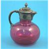 Image 1 : A Victorian ruby glass claret jug of globular form with plated mount....