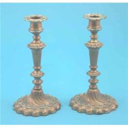 A pair of Victorian Old Sheffield plate candlesticks with knopped stems and spiral fluted bases,...