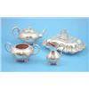 Image 1 : A Victorian three piece silver tea set of compressed circular form with scroll handles, floral de...