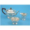 Image 1 : A George V three piece silver tea set of panelled circular form, Birmingham 1932, Gross 19 oz....