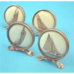 An Edwardian set of four silver menu holders inset with watercolours of yachts, Chester 1909....