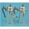 Image 1 : A pair of George V silver cafe au lait pots with scroll handles, Birmingham 1935, Gross 21.5 oz....