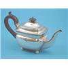Image 1 : A George III silver teapot of plain rectangular form with ebonised handle and ball feet, Makers P...