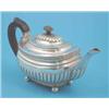 Image 1 : A George III silver teapot of demi fluted rounded rectangular form with ebonised handle and ball...