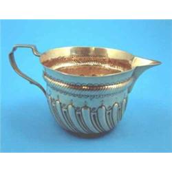 A Victorian spiral fluted silver milk jug....