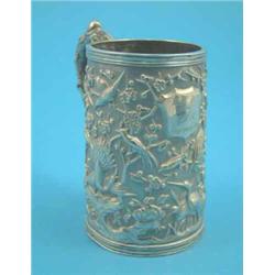 A Chinese silver mug decorated in relief with birds amongst prunus branches, with inscription dat...