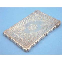 A Victorian silver card case engraved with flowers....