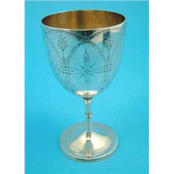 A Victorian silver goblet with bright cut engraving....
