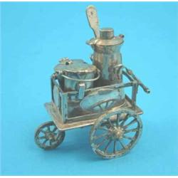 A plated novelty "milk cart" condiment set....