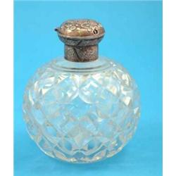 A Victorian cut glass globular scent bottle with silver top, Maker William Comyns, 1893, 6.25 ins...