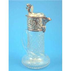 An Edwardian plated and glass claret jug....