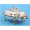 Image 1 : A Victorian plated tureen and stand of serpentine oval form with floral scroll border....