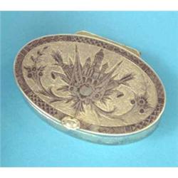 A Russian parcel gilt oval niello snuff box decorated with a coat of arms, 2.75 ins....