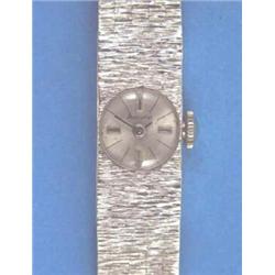 A ladys 9ct white gold Accurist wrist watch with integral textured bracelet....