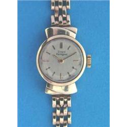 A lady's 9ct gold Gerard Perregaux wrist watch with stylish lugs and gatelink bracelet....