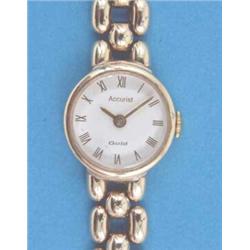 A lady's 9ct gold Accurist wrist watch with white Roman dial and flexible bracelet....