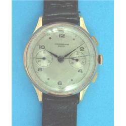 A gentlemans 18ct gold chronograph wrist watch with silvered dial....