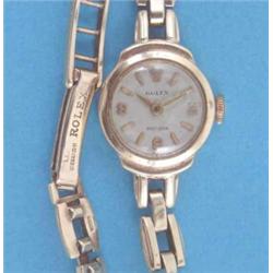 A lady's 9ct gold Rolex Precision wrist watch with gatelink bracelet....