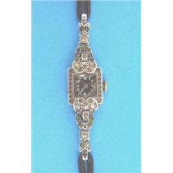 A lady's paste set platinum wrist watch....