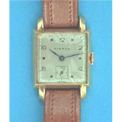 A gentlemans 18ct gold Pierce wrist watch with square case and silvered dial....