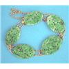 Image 1 : A Chinese gold and carved jade plaque bracelet...