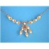 Image 1 : A modern gold and cultured pearl necklace, designed as pairs of leaves, on a 9ct gold trace link...