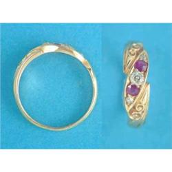 A late Victorian 18ct gold 5-stone ruby and diamond crossover ring, with scroll carved bezel....