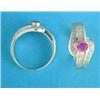 Image 1 : A 14ct white gold ring, collet set with an oval ruby and bands of baguette and round cut diamonds...