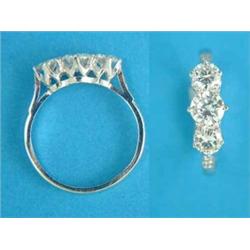 An 18ct white gold 3-stone diamond ring, the shoulders set small diamonds, total weight approxima...