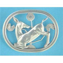 A Georg Jensen silver brooch, depicting a deer and stylised flower heads, No.256...