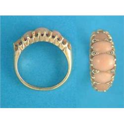An 18ct gold half hoop ring, set 5 oval corals and diamond points...