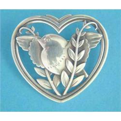 A Georg Jensen silver heart shape brooch depicting a bird and foliage, No.239...