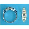 Image 1 : A white gold 3-stone diamond ring, the millegrain set rectangular cut stones flanked by baguette...