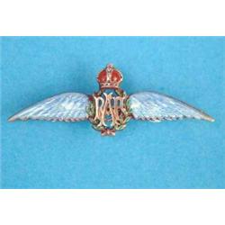 A silver and enamel R.A.F. lapel pin (cased)...